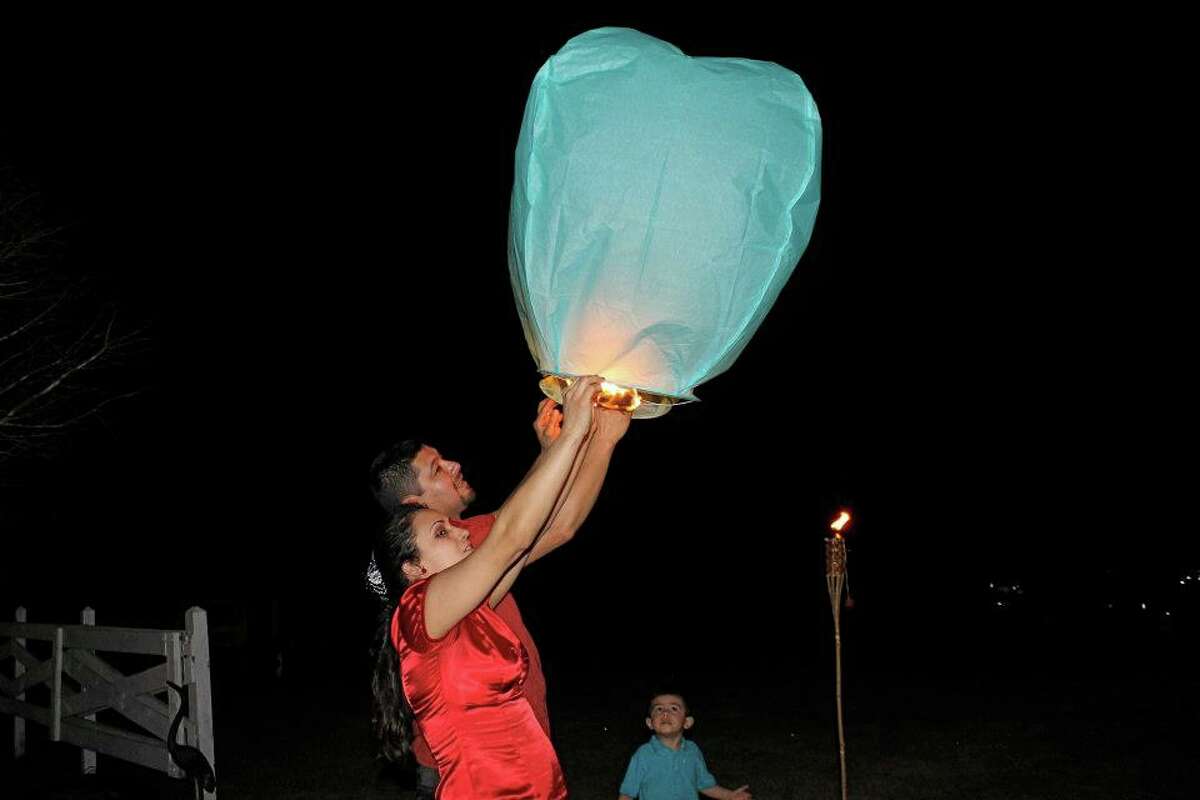 The mysterious lights that had nervous sky-watchers dialing 911 on Saturday night came not from Mars or Venus, but from "wish lanterns" released during a wedding celebration on the east side of Liberty County.