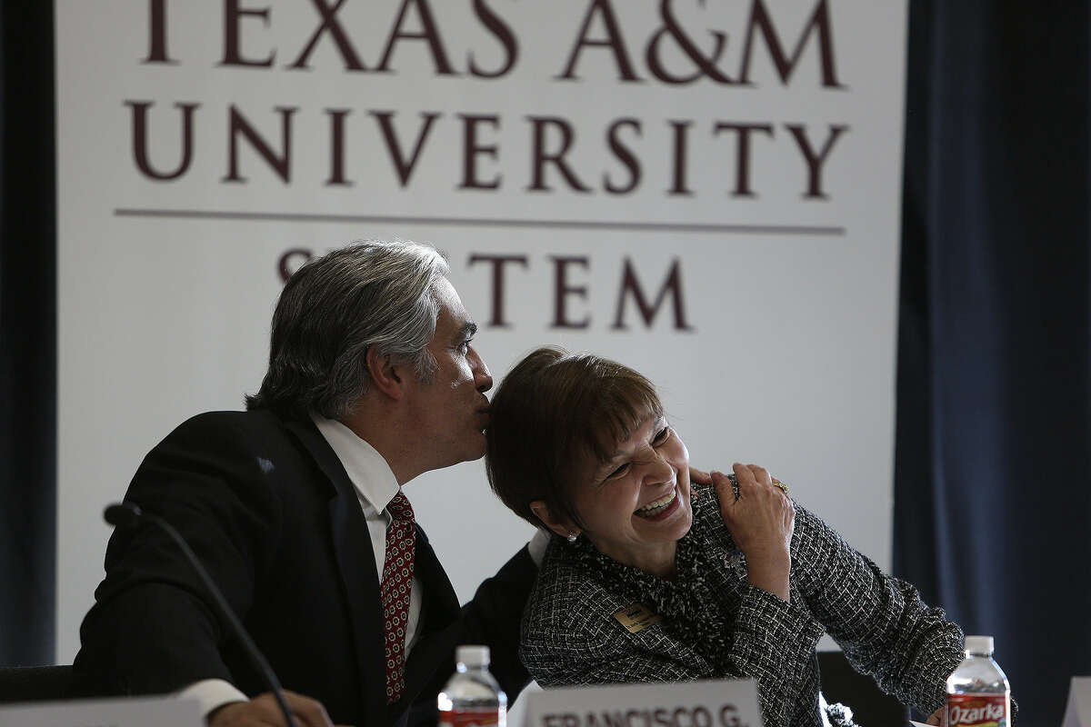 University of Texas System Chancellor Francisco Cigarroa embraces Maria Hernandez Ferrier, president of Texas A&M University-San Antonio, as they are introduced for a discussion on “Broadening the Pathway to Higher Education in Texas.”
