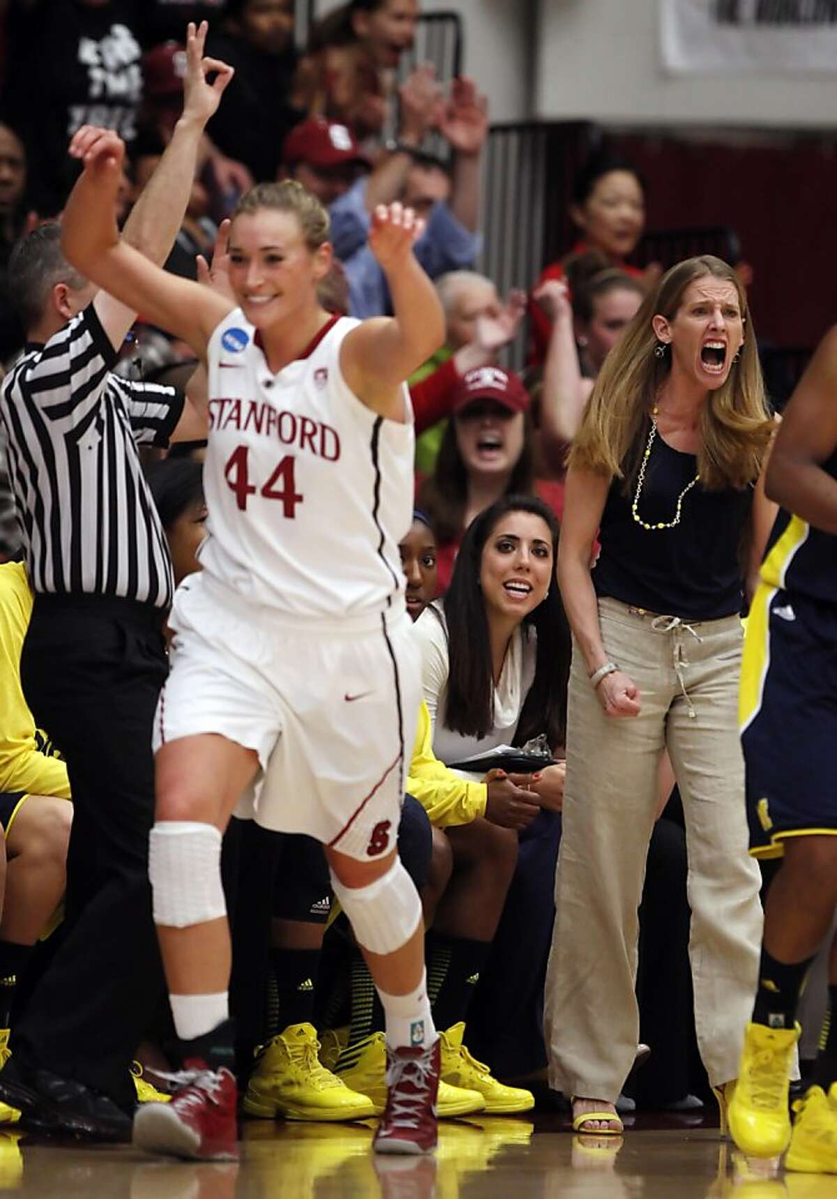 Michigan Head Coach Kim Barnes Arico reacts after Joslyn Tinkle scores a three point shot in the first half. The Stanford Cardinal played the Michigan Wolverines at Maples Pavilion in Stanford, Calif., on Tuesday, March 26, 2013.