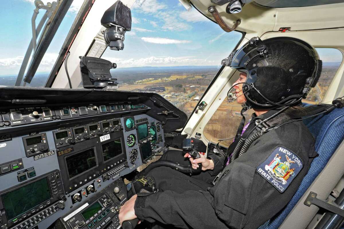 Kathy Humphries, Tech Sgt. with the NYS police, pilots a helicopter near the Albany International Airport on Wednesday, March 27, 2013 in Colonie, N.Y. Tech Sgt. Humphries recently made New York State Police history when she piloted an all female medevac flight mission. On that mission were two female paramedics from Colonie, Mary Beth Pulver and Mary Pat Provost. Humphries is the first and only female State Police helicopter pilot. The former U.S. army pilot has been with the state police for 18 years. (Lori Van Buren / Times Union)