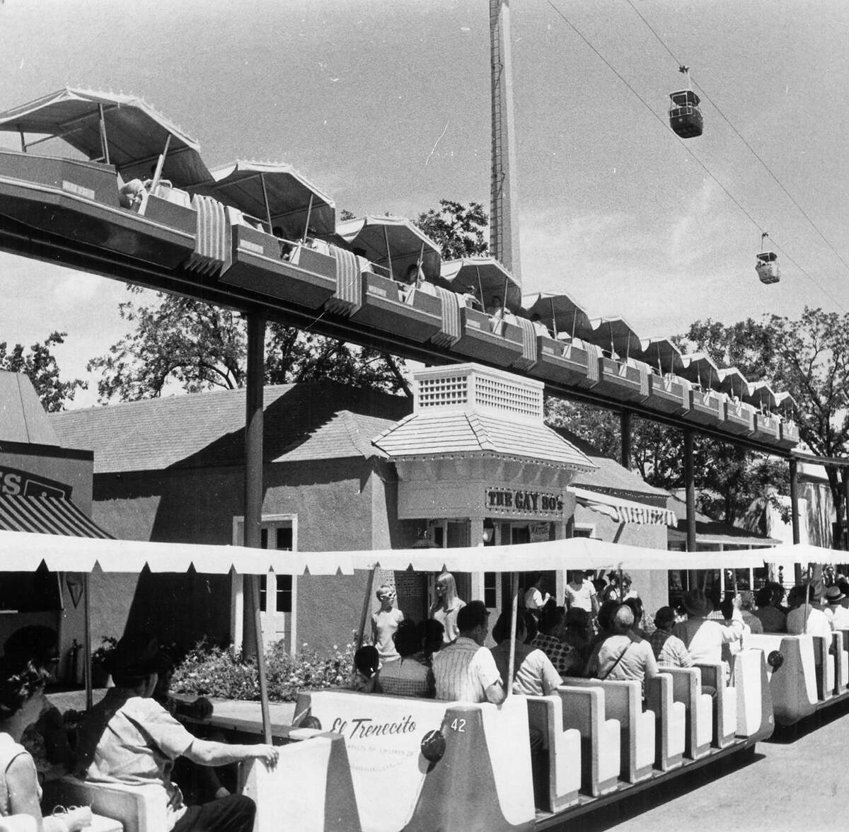 Visitors to HemisFair '68 ride the mini-monorail (top) and El Trenecito (the little train, bottom) on July 19, 1968. A round-trip on the monorail cost $1, whereas a trip on the train cost 50 cents for adults and 25 cents for children.