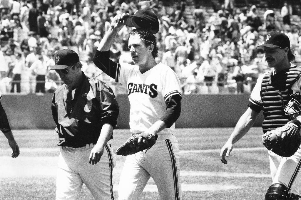 Former San Francisco Giants' Jeffrey Leonard, left, Will Clark, center, and  Robby Thompson take the field as part of a tribute to the Giants 1987 team  before the baseball game against the