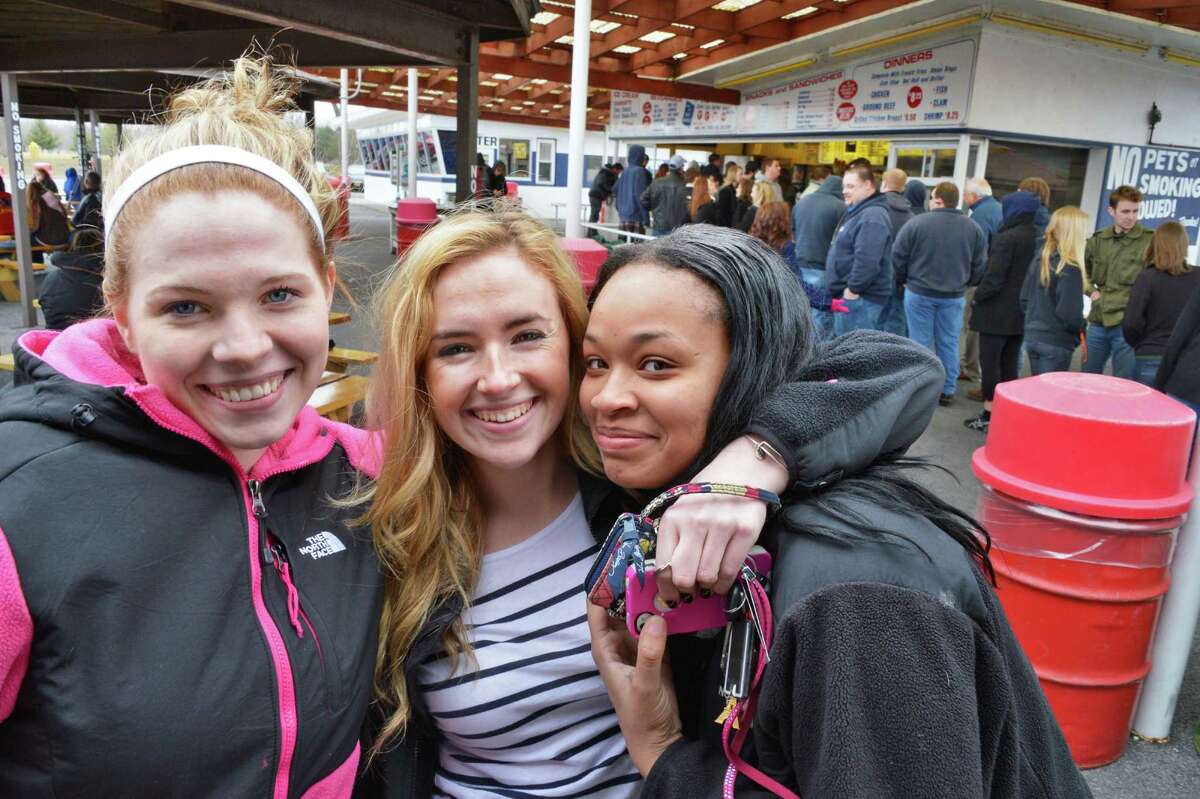 Niskayuna High seniors, from left, Mackenzie Jones, Chloe Bellcourt and Janajah Frazier pose for a photo as they wait on queue as Jumpin' Jack's Drive-In in Scotia opens for the season Thursday March 28, 2013. (John Carl D'Annibale / Times Union)