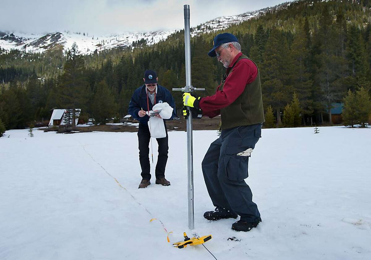 State Department of Water Resources officials Keith Swanson, left, and Frank Gehrke take snow samples at Phillips Station in El Dorado county on Thursday, March 28, 2013. Snow surveyors reported that water content in CaliforniaÕs snowpack is only 52 percent of normal.(Randall Benton / The Sacramento Bee)