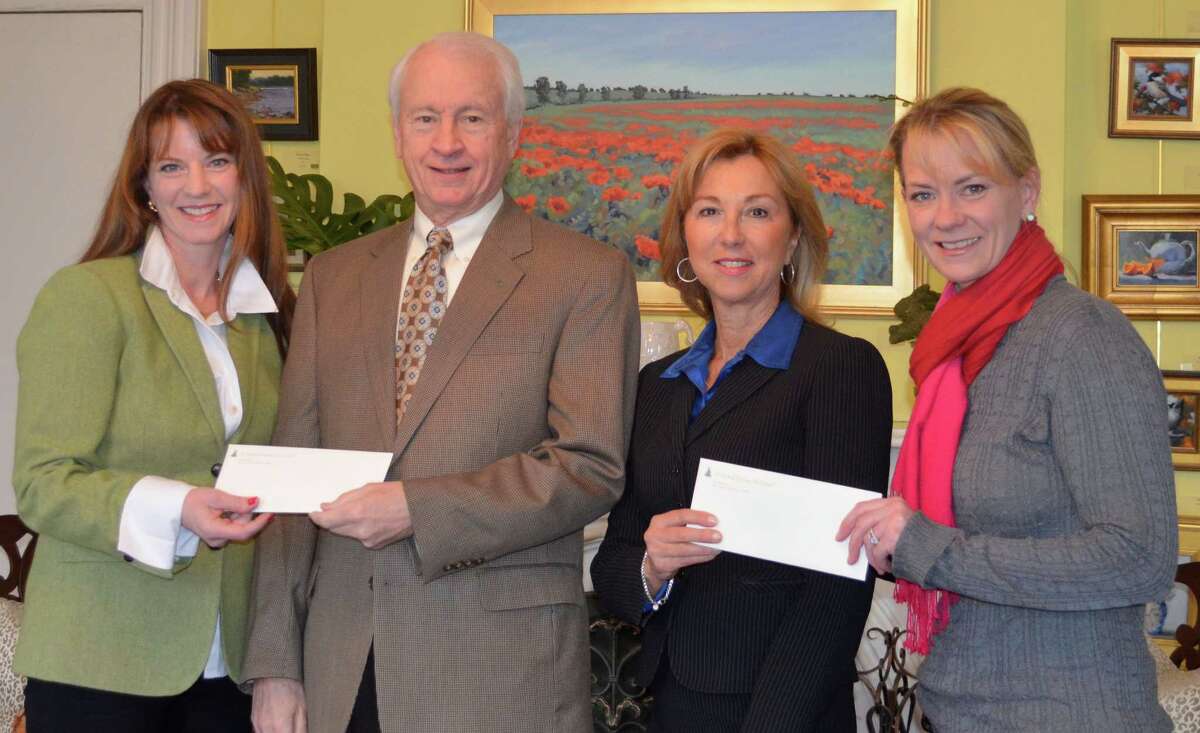 The Fairfield Christmas Tree Festival has awarded $125,000 each to the two beneficiaries of the 2012 festival, the Cardinal Shehan Center in Bridgeport and the Fairfield-based Norma F. Pfriem Breast Care Center. Displaying the checks are, from left, Moira Rachel, festival president; Terry OíConnor, Cardinal Shehan Center executive director; Donna Twist, Pfriem Center executive director; and Colleen Murphy, festival vice president