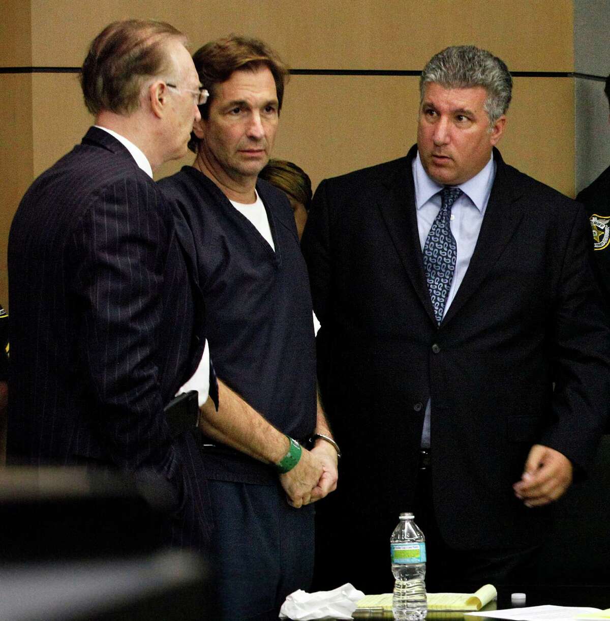John Goodman, center, talks with his attorneys Roy Black and Guy Fronstin during his sentencing hearing on May 11 in West Palm Beach, Fla. (AP Photo/The Palm Beach Post, Lannis Waters, Pool)