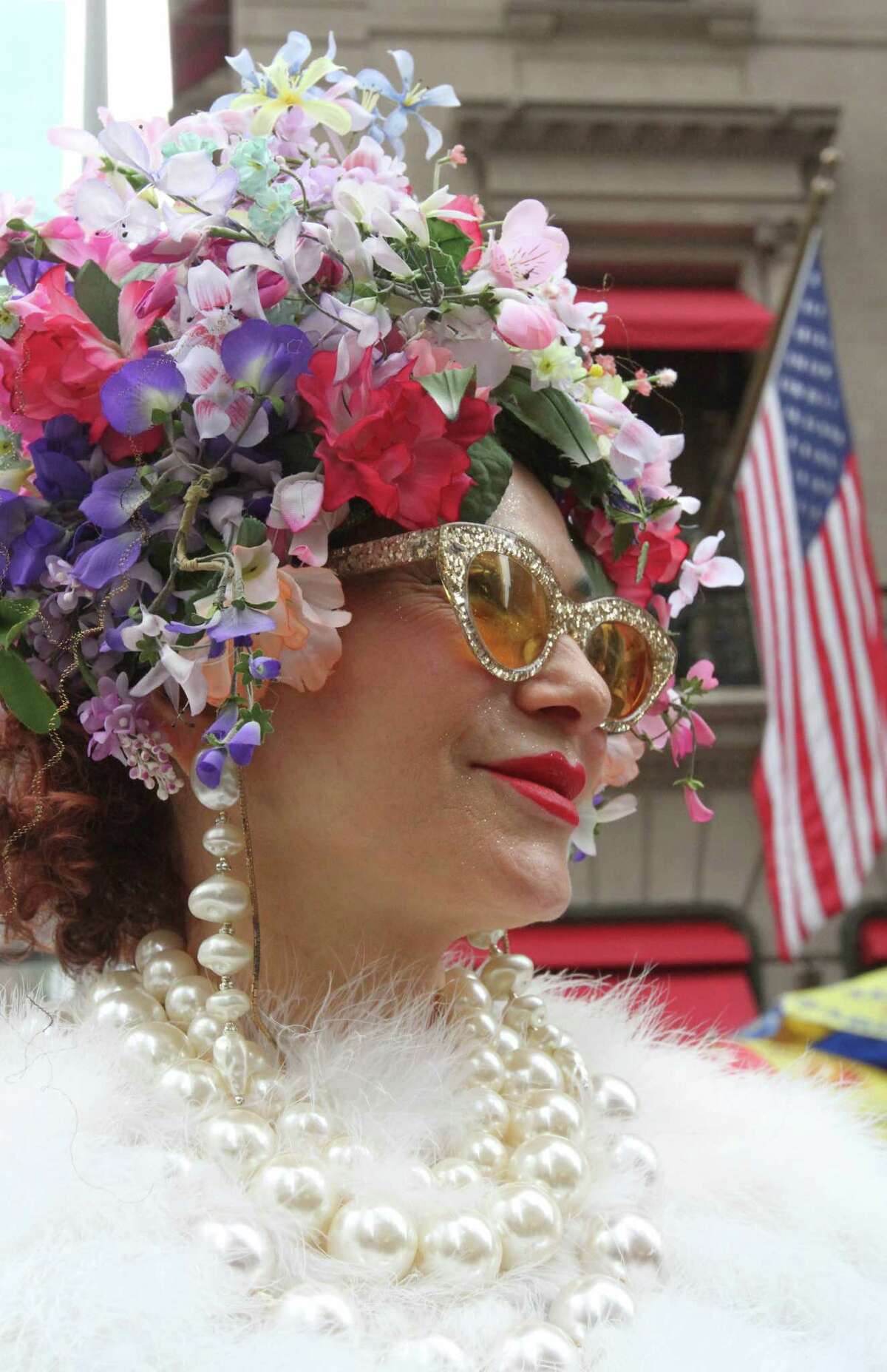 Dressed for the occasion, Purely Patricia Fox, of New York, poses for photographs on New York's Fifth Avenue as she takes part in the Easter Parade, Sunday, March 31, 2013.