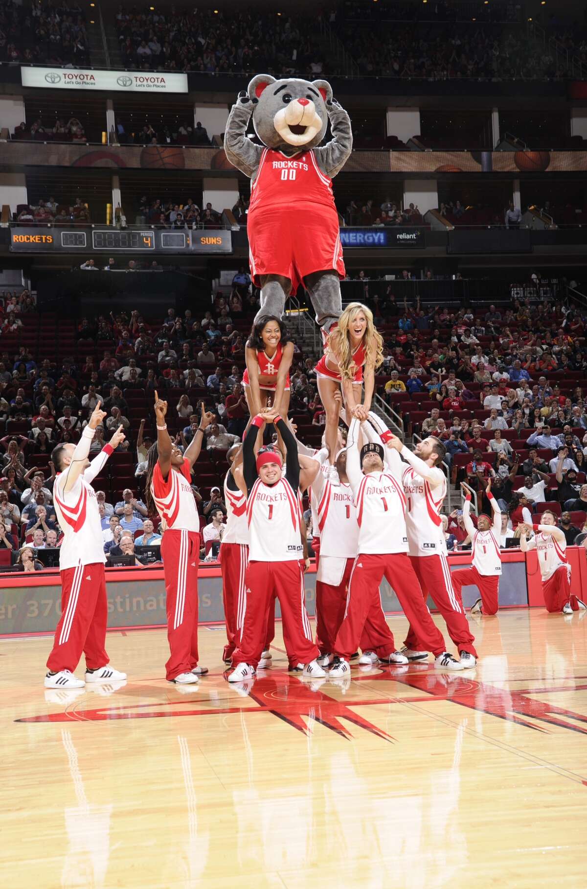 Clutch at the top of the pyramid at a Rockets game. HOUSTON, TX - MARCH 13: The Launch Crew and Clutch Mascot of the Houston Rockets perform during the game against the Phoenix Suns on March 13, 2013 at the Toyota Center in Houston, Texas. NOTE TO USER: User expressly acknowledges and agrees that, by downloading and or using this photograph, User is consenting to the terms and conditions of the Getty Images License Agreement. Mandatory Copyright Notice: Copyright 2013 NBAE (Photo by Bill Baptist/NBAE via Getty Images)