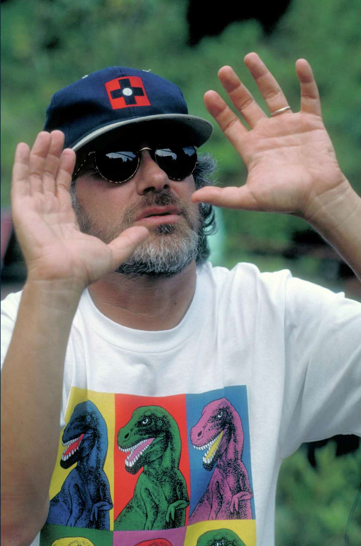 Director Steven Spielberg turned the book into a film. Here, he wears a Warhol-inspired dinosaur t-shirt while directing the movie.