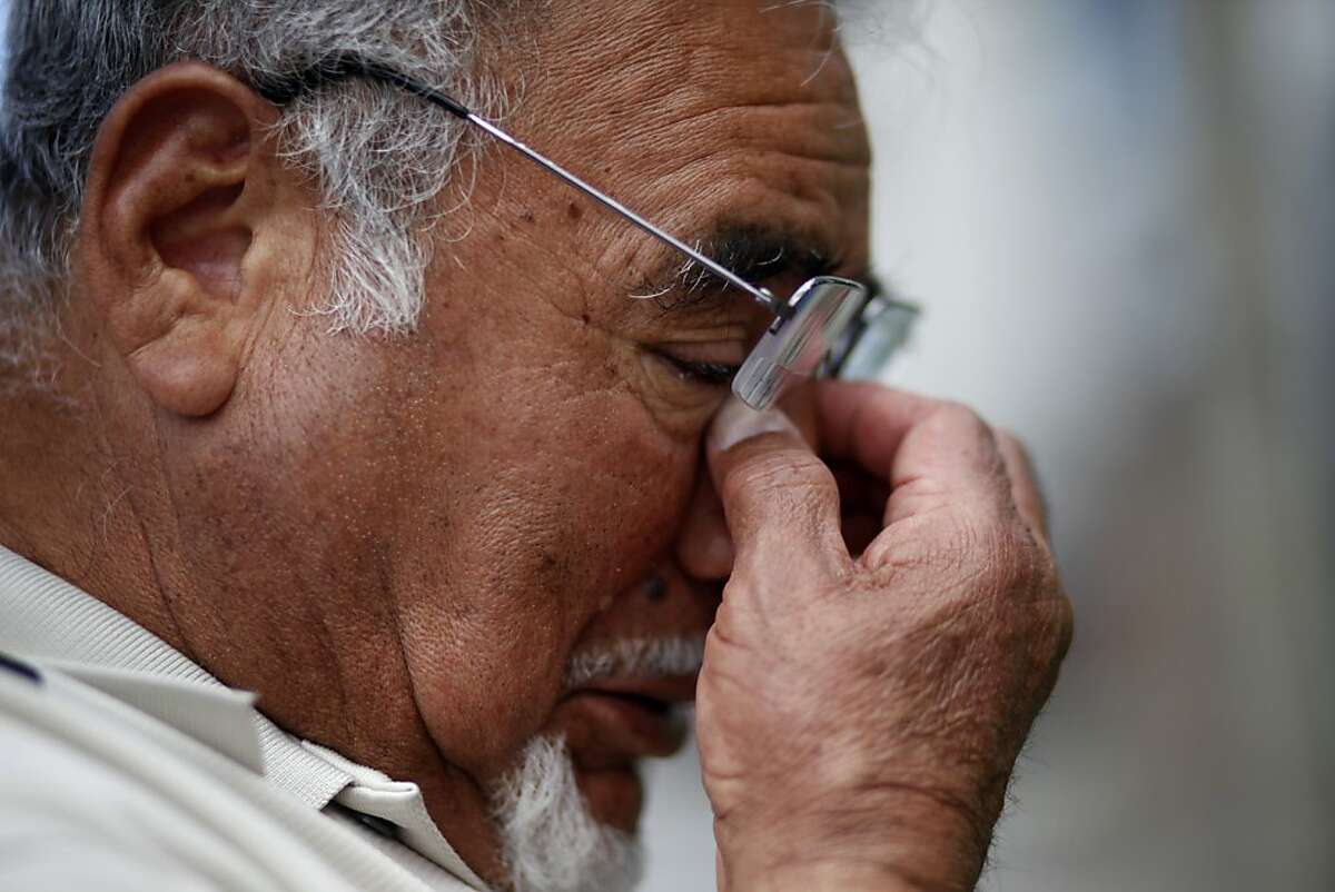 Carlos Valdiviezo cries as he talks about trying to revive his son Jacob, Monday April 1, 2013, after he was shot on the front steps of their home, Saturday morning in San Francisco, Calif.