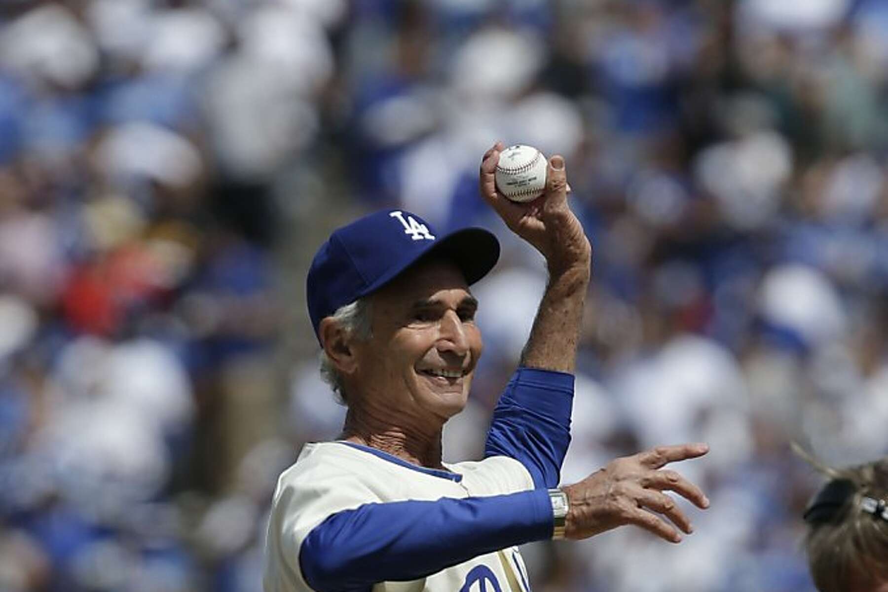 Former Dodger Sandy Koufax throws out the first pitch before the Los  Angeles Dodgers play the San Francisco Giants on opening day at Dodger  Stadium in Los Angeles on April 1, 2013.