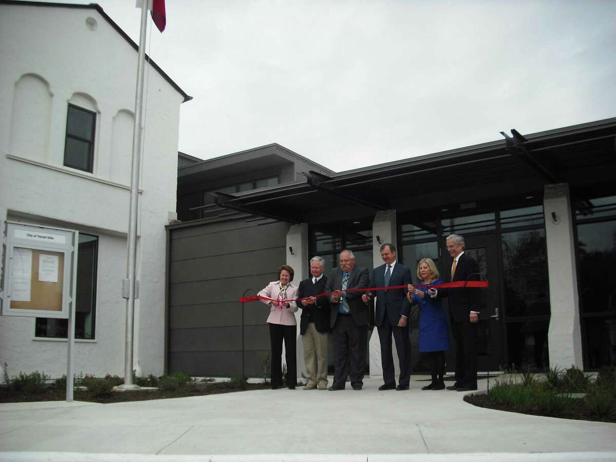 Terrell Hills City Manager Columbus Stutes (third from left) and City Council members cut the ribbon March 27 at the city's new municipal complex.