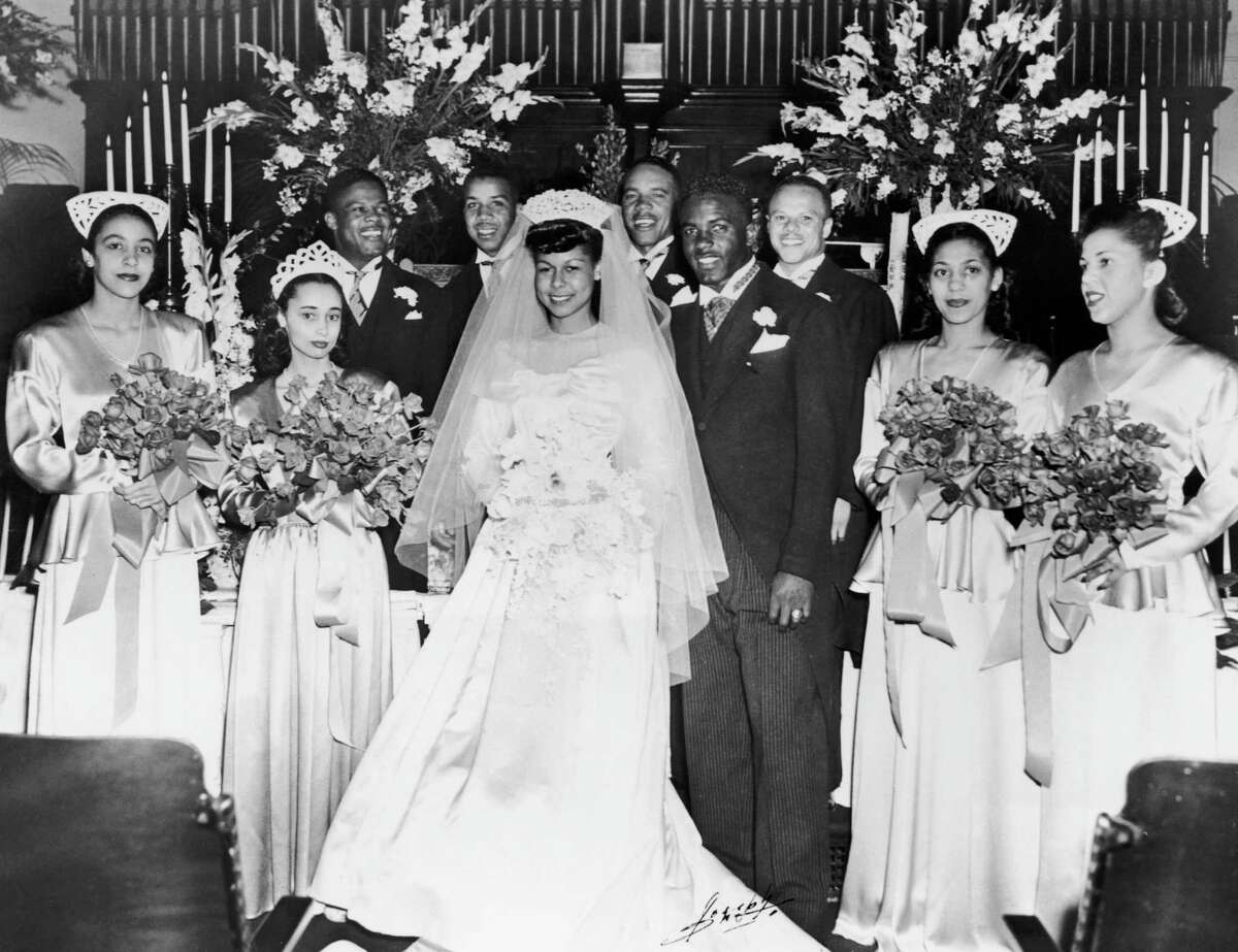 American baseball player Jackie Robinson marries Rachel Isum at the Independent Church in Los Angeles in 1946.