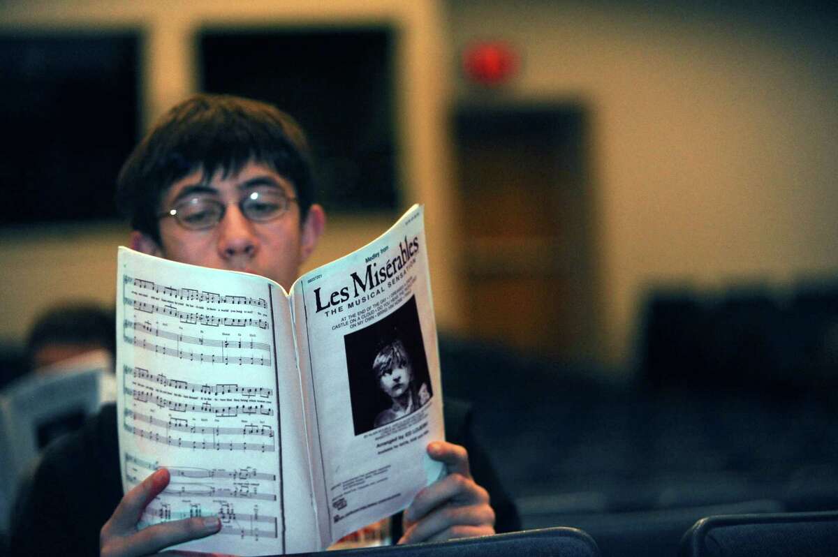 Michael Kural, 15, sings music from ìLes Misérablesî during the Greenwich High School chorus practice in the auditorium at school in Greenwich, Conn., Tuesday, April 2, 2013.