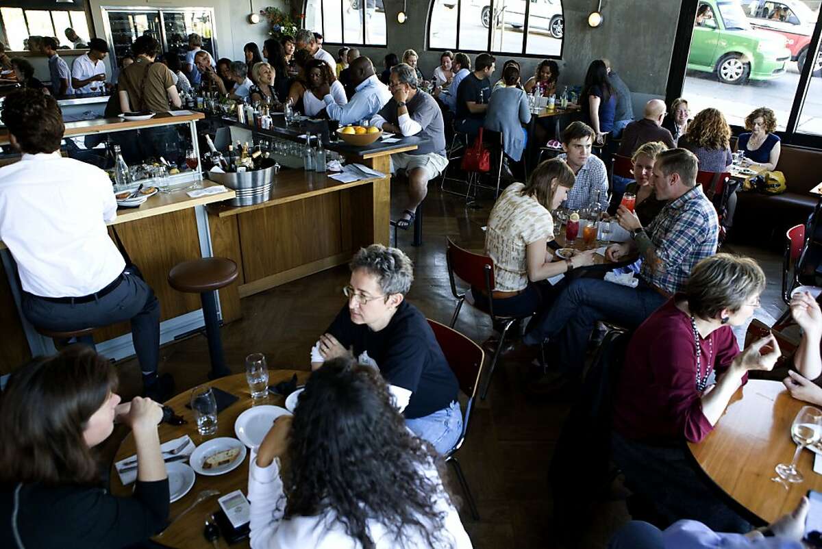 Adesso restaurant is packed with patrons during its happy hour on Tuesday, July 6, 2010 in Oakland, Calif.
