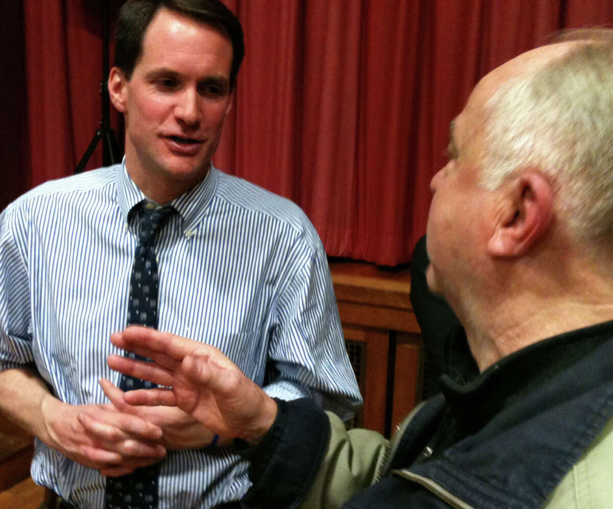 U.S. Rep. Jim Himes, D-4, talks with a constituent after Himes' Tuesday night Town Hall-style meeting in Roger Sherman School. FAIRFIELD CITIZEN, CT 4/2/13