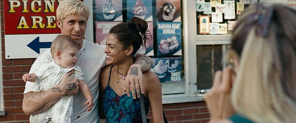 (l to r) Ryan Gosling stars as Luke and Eva Mendes stars as Romina in Derek Cianfrance's sweeping emotional drama, The Place Beyond the Pines, a Focus Features release.