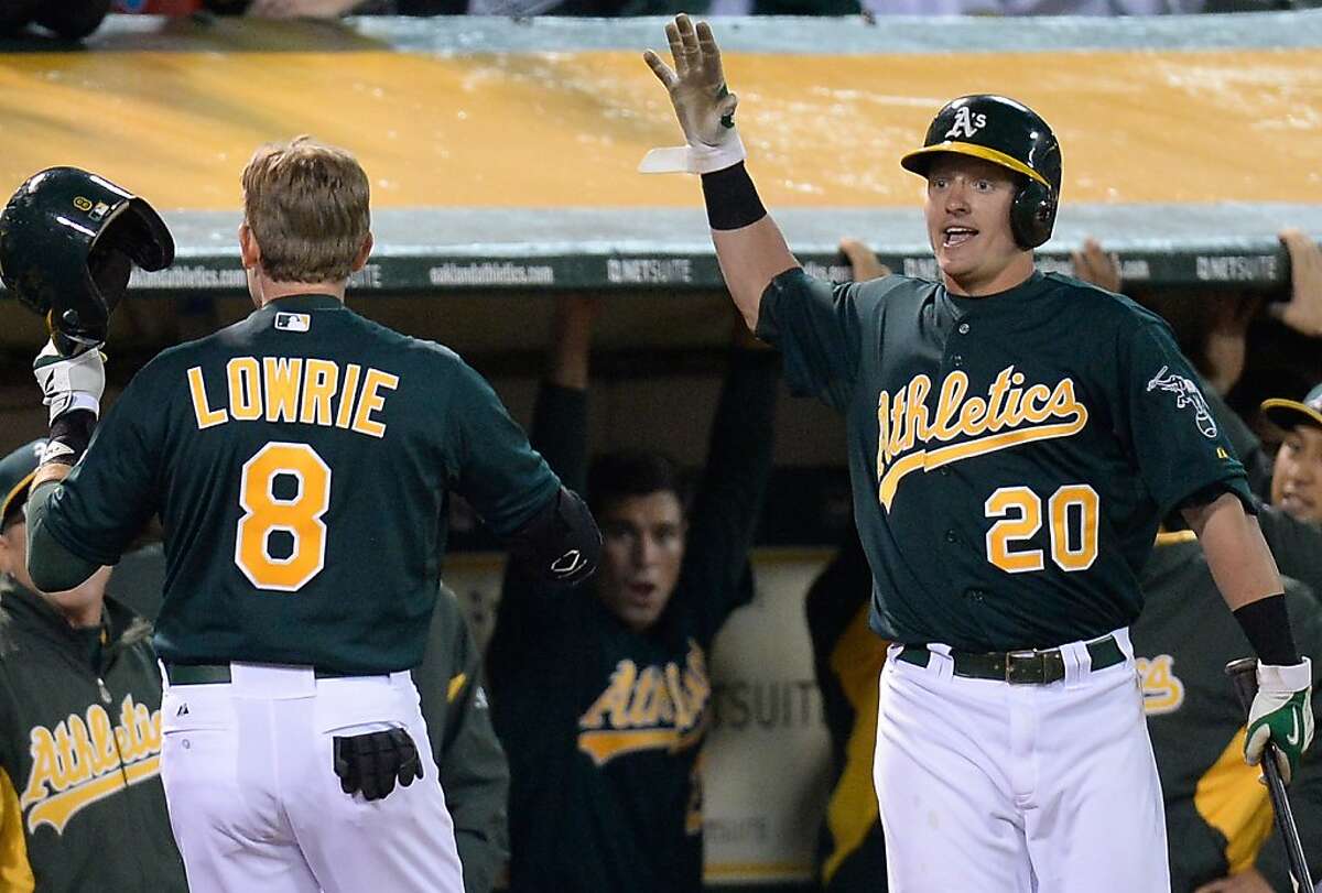 A's break out bats to defeat Mariners