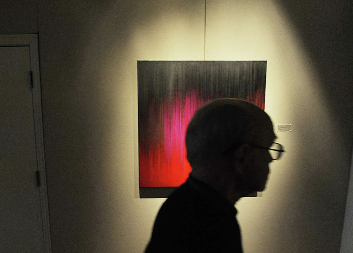 A man walks past a work titled "Sanctum," by Gail Resen during the Greenwich Arts Council opening reception for the exhibition "Constructions, Paintings & Drawings," by Resen and her husband, Ken Resen, of Mamaroneck, N.Y., at the council's Bendheim Gallery in Greenwich, Thursday, April 4, 2013. Their exhibit runs through May 18. Gallery hours are Monday through Friday, 10 a.m. to 5 p.m., and Saturday and Sunday, noon to 4 p.m. Admission is free. For more information, call 203-862-6751.