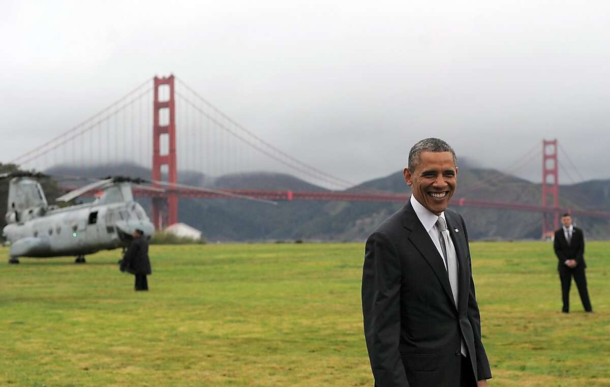 US President Barack Obama smiles before boarding Marine One helicopter from a field overlooking the iconic golden gate bridge in San Francisco, California, on April 4, 2013. Obama is in California to attend two DCCC fund rising events. AFP PHOTO/Jewel SamadJEWEL SAMAD/AFP/Getty Images