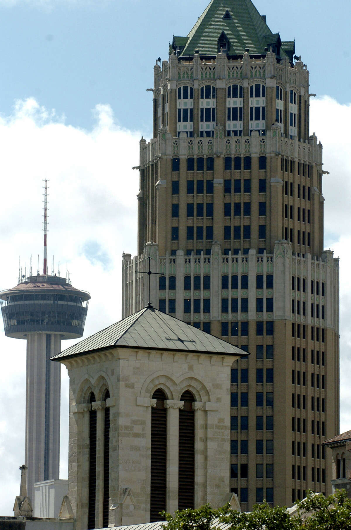 Architecture in San Antonio — San Fernando Cathedral (foreground), the Tower Life building (right) and the Tower of the Americas.