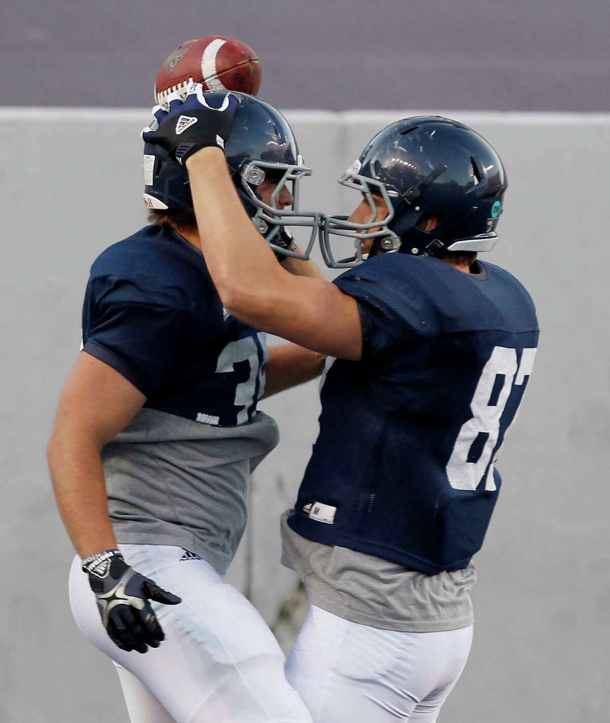 Rice tight end Connor Cella celebrates a touchdown reception with running back Luke Turner.