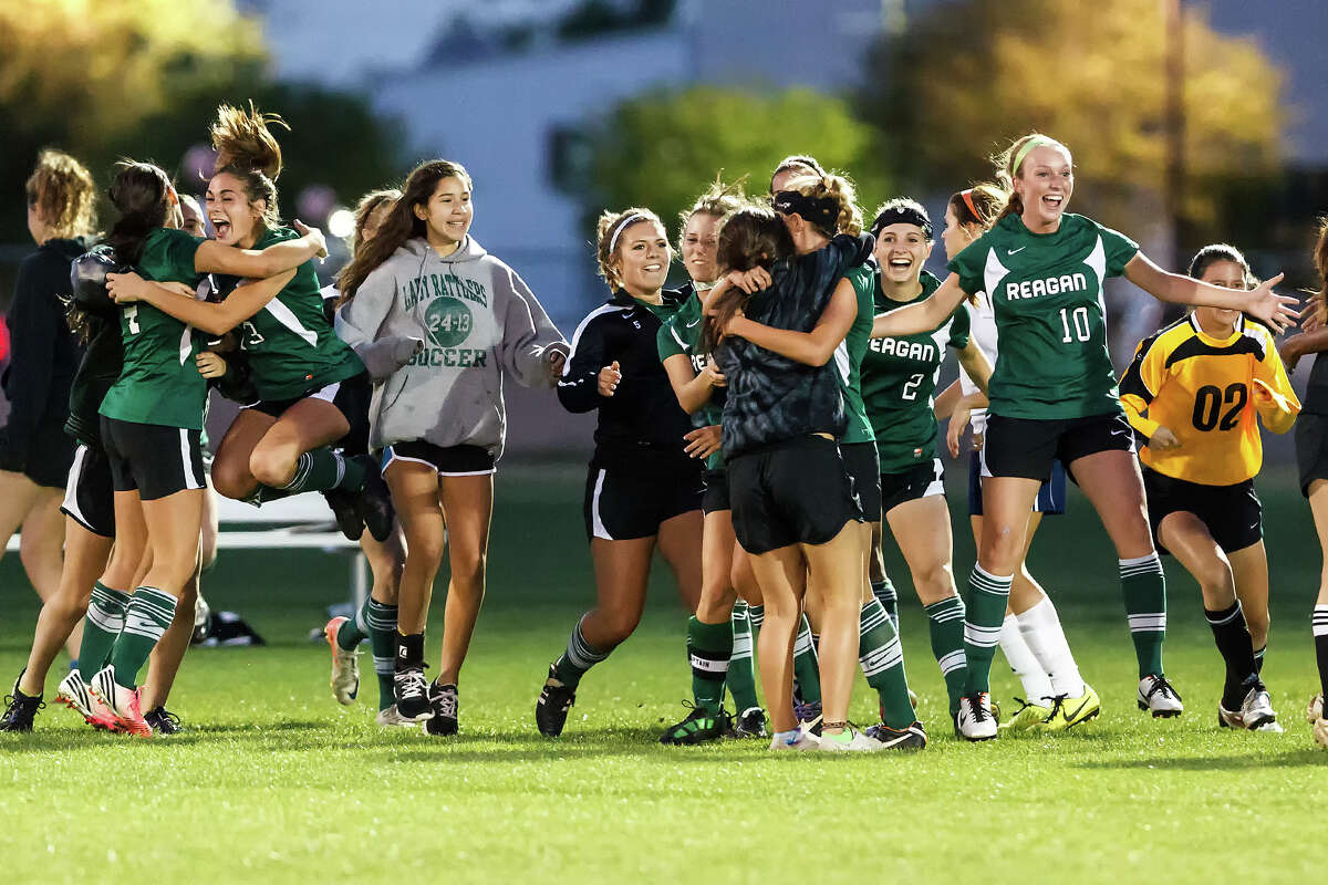 The Reagan Lady Rattlers celebrate their 2-1 overtime victory over Brandeis in their Class 5A second round playoff game.