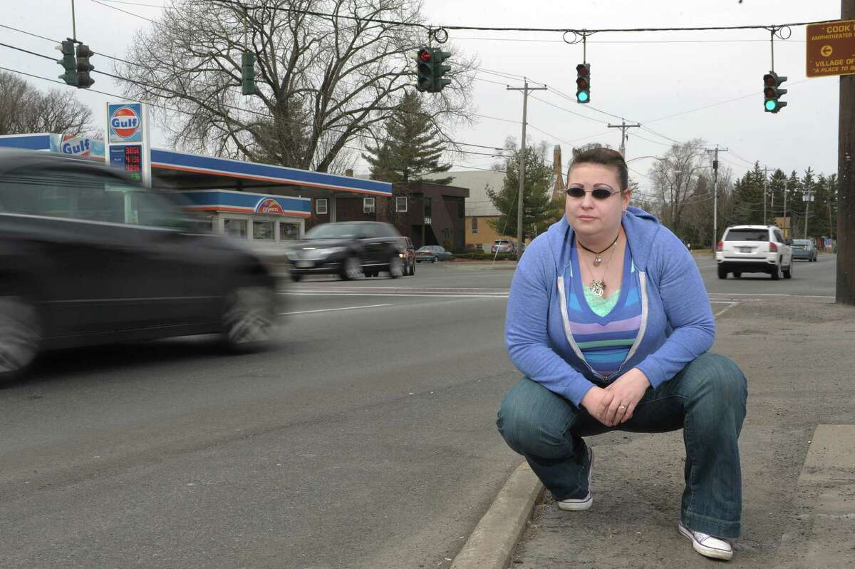 Colleen Ouellette poses along Central Ave. on Sunday, March 31, 2013 in Albany, NY. Ouellette was struck by a car while she was walking across Central Ave. in September of 2011. She was not seriously injured. (Paul Buckowski / Times Union)