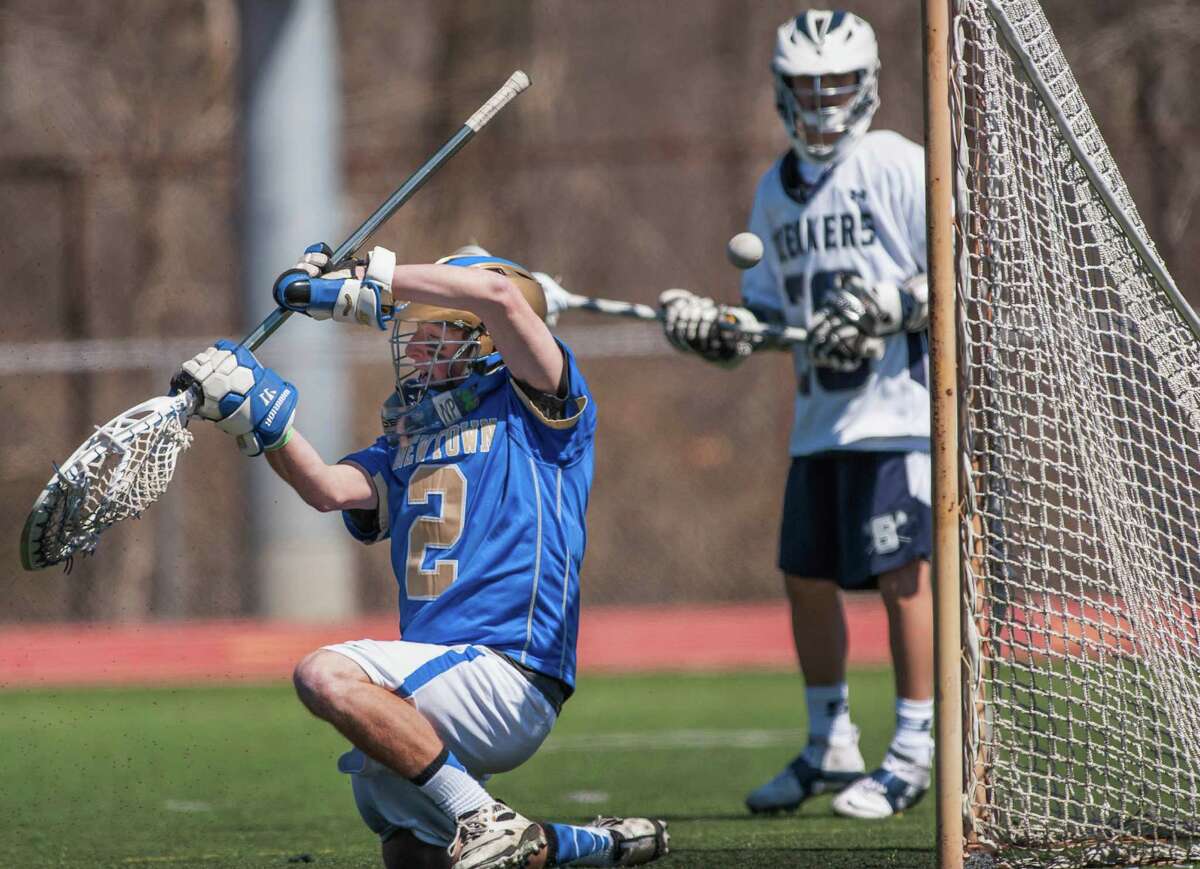 Staples boys lacrosse rolls past Newtown