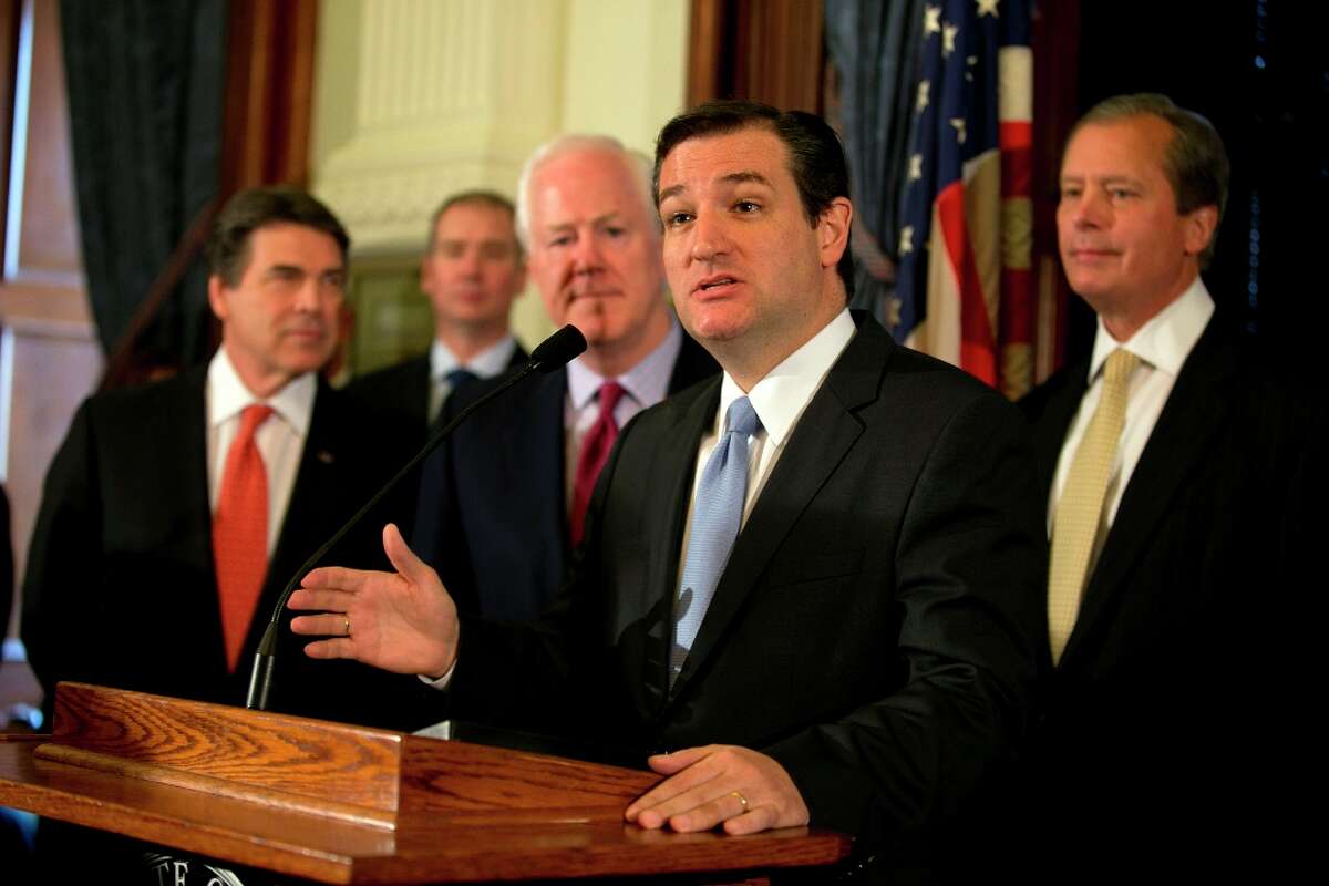 Senator Ted Cruz speaks during a news conference at the Capitol in Austin, Texas, on Monday, April 1, 2013. Cruz, along with other Republican officials, announced that they believe that Medicaid is a broken system, and that expanding it under the Affordable Care Act is the wrong move for Texas. Shown, from left, are Governor Rick Perry, US Senator John Cornyn and Lt. Gov. David Dewhurst. (AP Photo/Austin American-Statesman, Deborah Cannon)