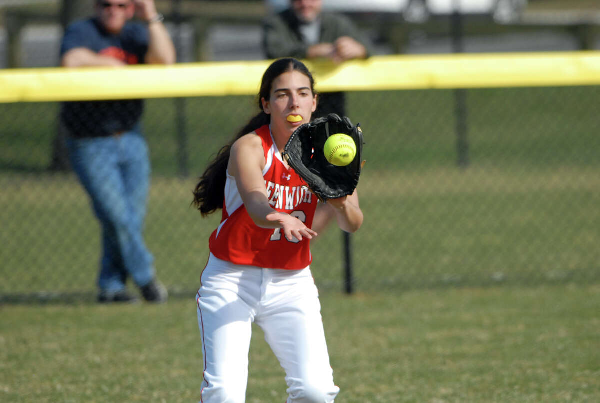 Greenwich's Erin White fields the ball as Greenwich High School hosts Trinity Catholic in a softball game in Greenwich, Conn., April 8, 2013. Greenwich won the game.