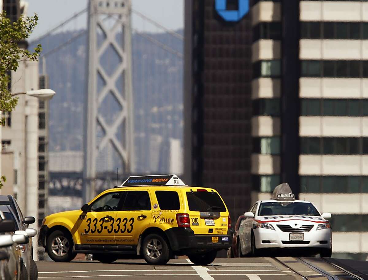 Two taxis cross paths on California Street and Mason Street in San Francisco, Calif., on Monday, April 8, 2013. A report for the SFMTA by a taxi consultant says the city needs 600-800 more taxis.
