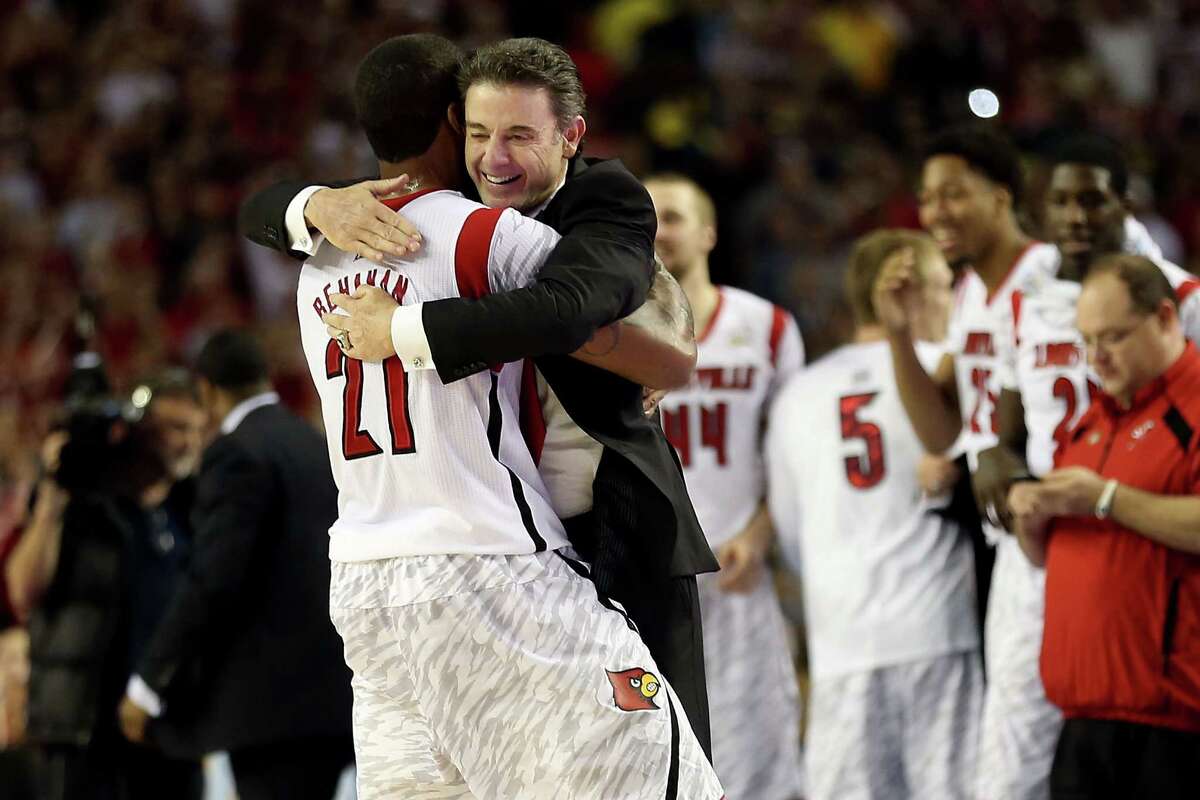ATLANTA, GA - APRIL 08: (L-R) Chane Behanan #21 and head coach Rick Pitino of the Louisville Cardinals celebrate after they won 82-76 against the Michigan Wolverines during the 2013 NCAA Men's Final Four Championship at the Georgia Dome on April 8, 2013 in Atlanta, Georgia. (Photo by Andy Lyons/Getty Images)