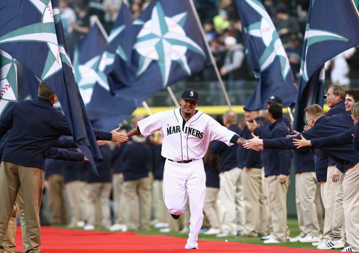 AngelShohei signs for a Mariners' fan at Safeco Field [05-05-18