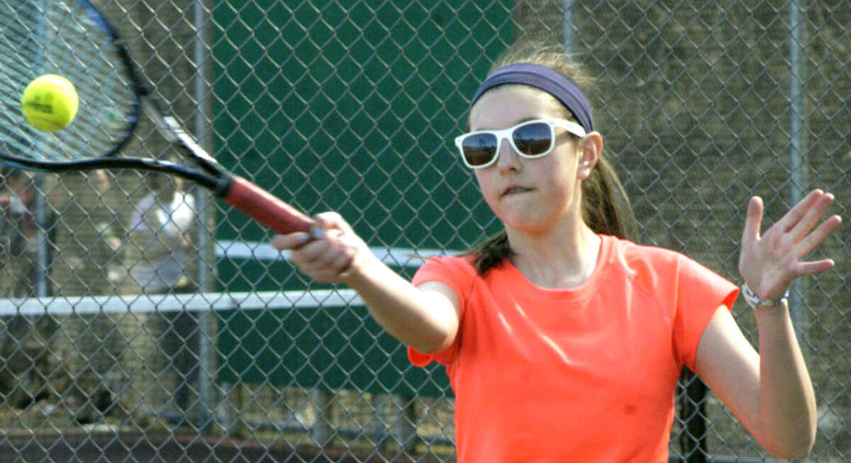 Amanda Aguayo of the Green Wave sports fashionable shades as she fine-tunes her game for New Milford HIgh School girls' tennis, April 2013