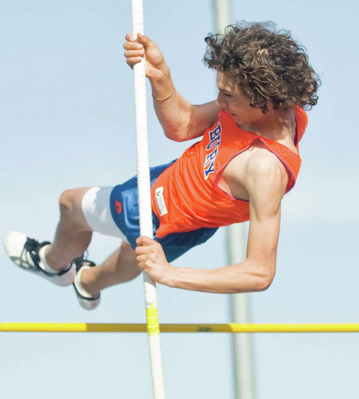 Danbury High School sophomore Alex Troche clears the bar in the pole vault event in the boys track meet at Danbury. Tuesday, April 9, 2013