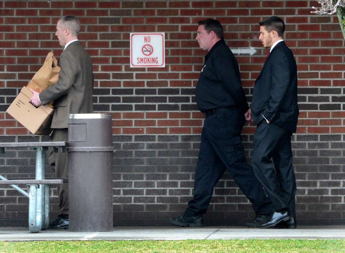 Albany County sheriff's employees arrest Albany County sheriff's employees last week. Corrections officer Timothy Robillard is escorted out of the county Jail after being arrested Wednesday morning, April 10, 2013. Robillard is accused of running a Capital Region bookmaking ring in which bets and payoffs were routinely taking place at the jail. (Skip Dickstein/Times Union)