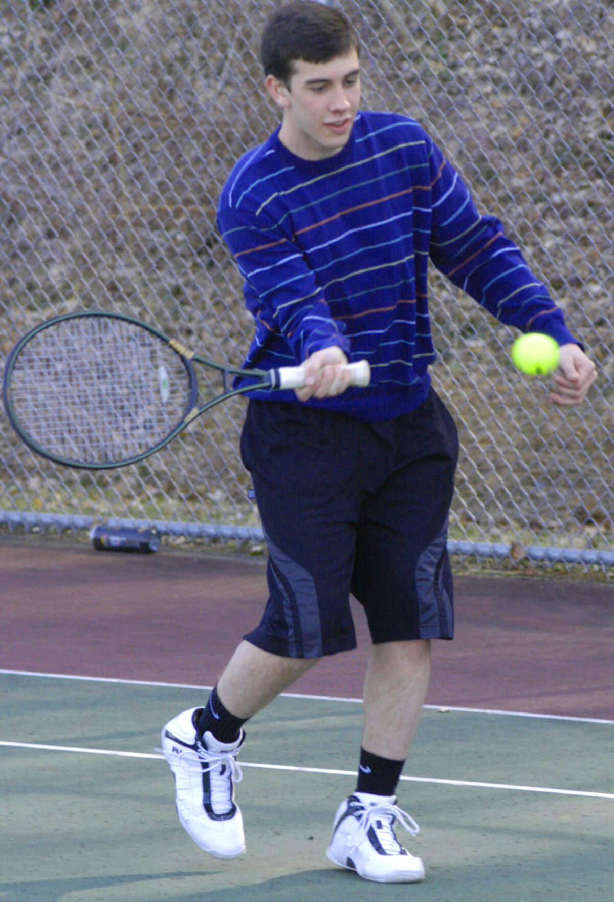 Daniel Buser of the Green Wave eases into a forehand for New Milford High School boys' tennis, April 2013