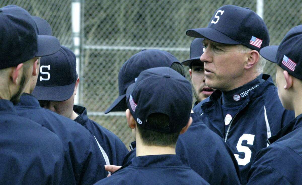 Spartan coach Scott Werkhoven offers final words of counseling to his players prior to a pre-season scrimmage for Shepaug Valley High School baseball. April 2013