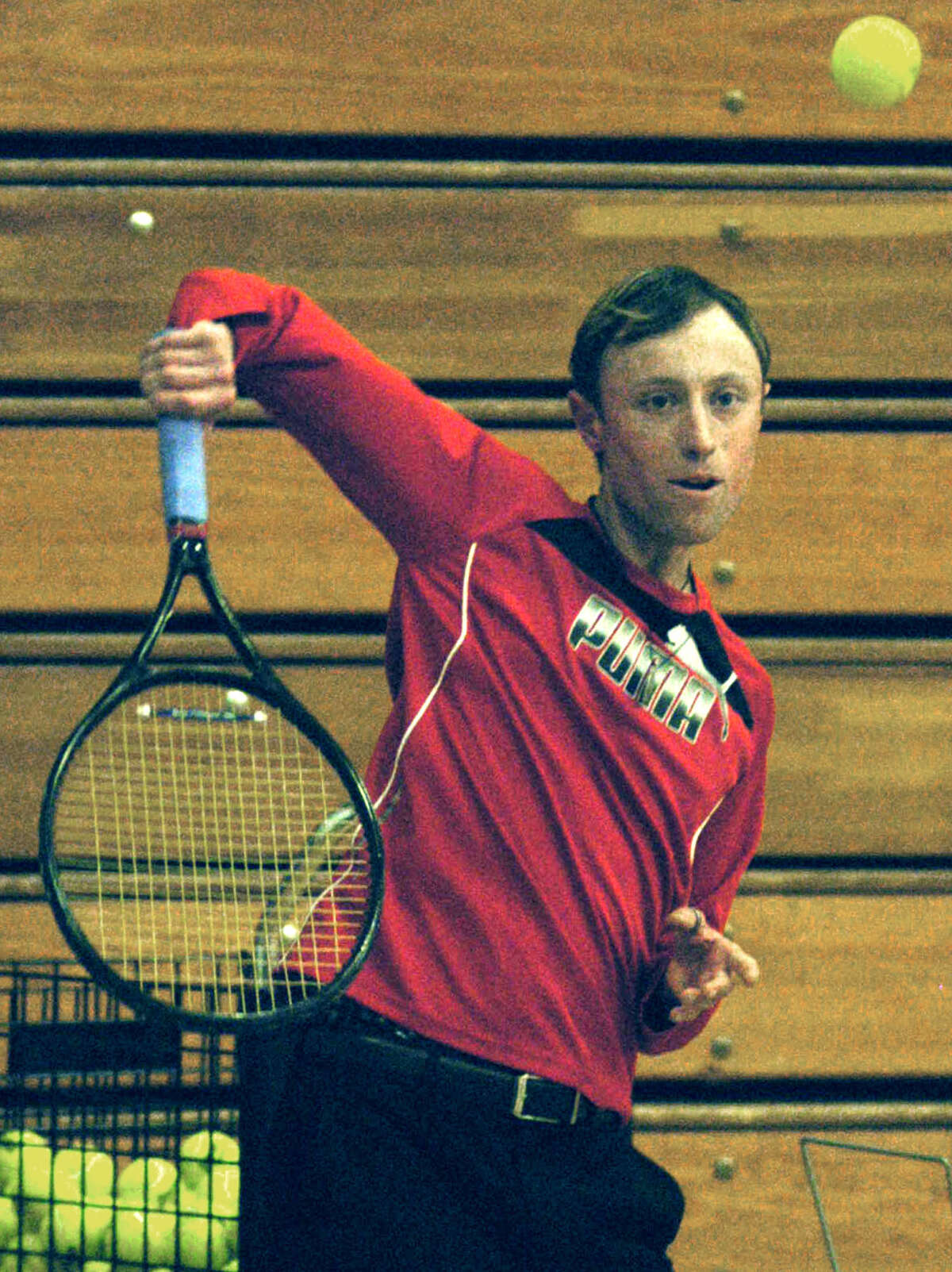 Assistant coach Stephen Riley demonstrates his racquet skills during pre-season practice for Shepaug Valley High School boys' tennis. April 2013