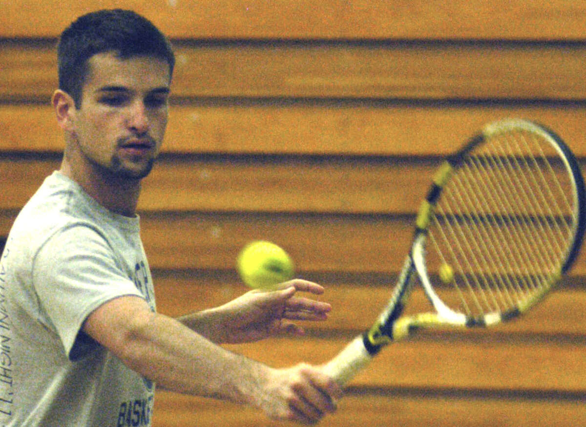Kellen Rikhoff of the Spartans deftly crafts a backhand during indoor practice on a rainy day for Shepaug Valley High School boys' tennis. April 2013