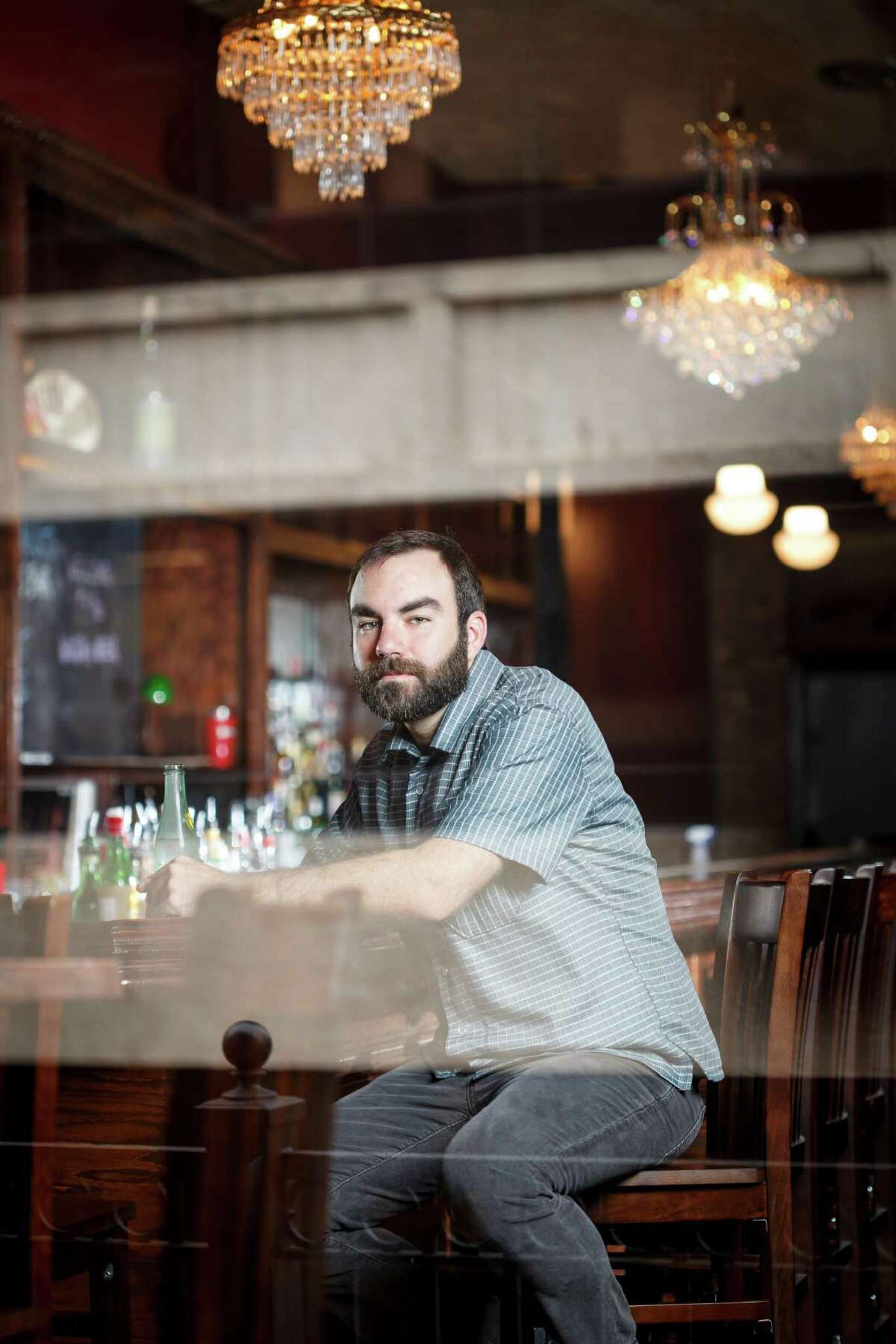 Bartender and owner Justin Burrow poses for a portrait at Captain Foxheart's Bad News Bar & Spirit Lodge, Tuesday, April 2, 2013, in Houston. ( Michael Paulsen / Houston Chronicle )