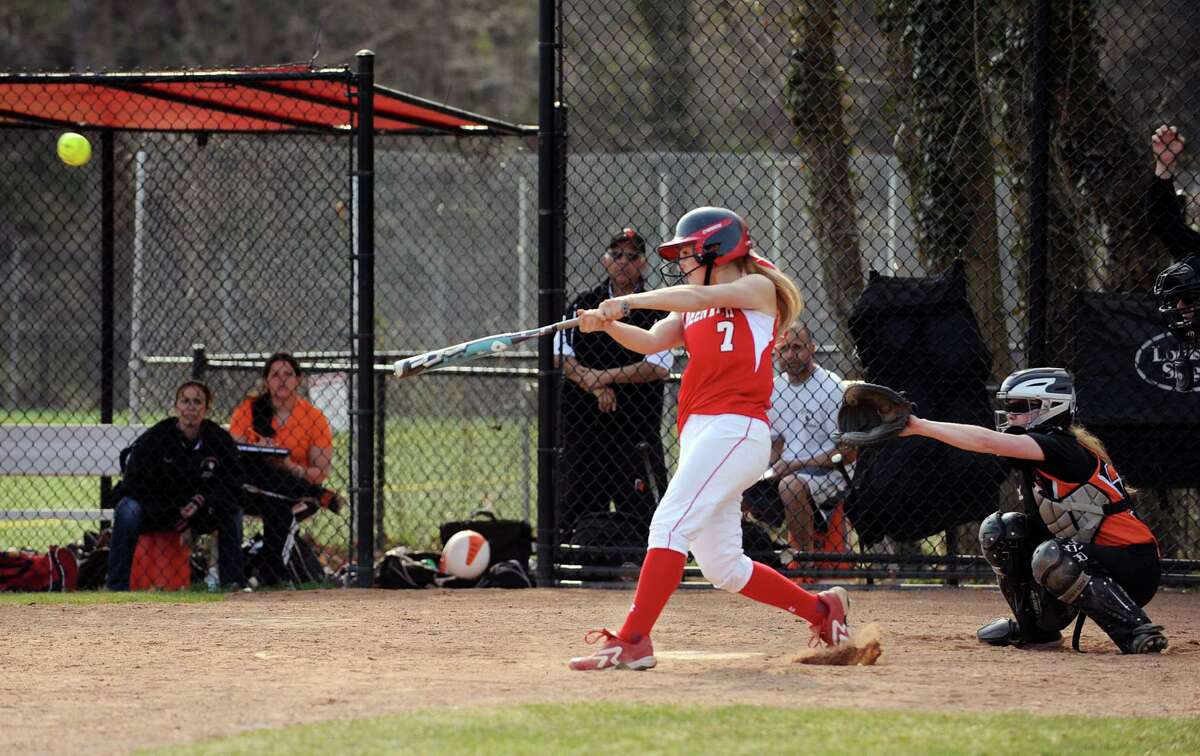 Rebecca DeCarlo of Greenwich hits a homerun to lead off the game for Greenwich in the bottom of the first inning during the girls high school softball game between Greenwich High School and Stamford High School at Greenwich, Wednesday, April 10, 2013. Greenwich won the game 7-5 to remain unbeaten.