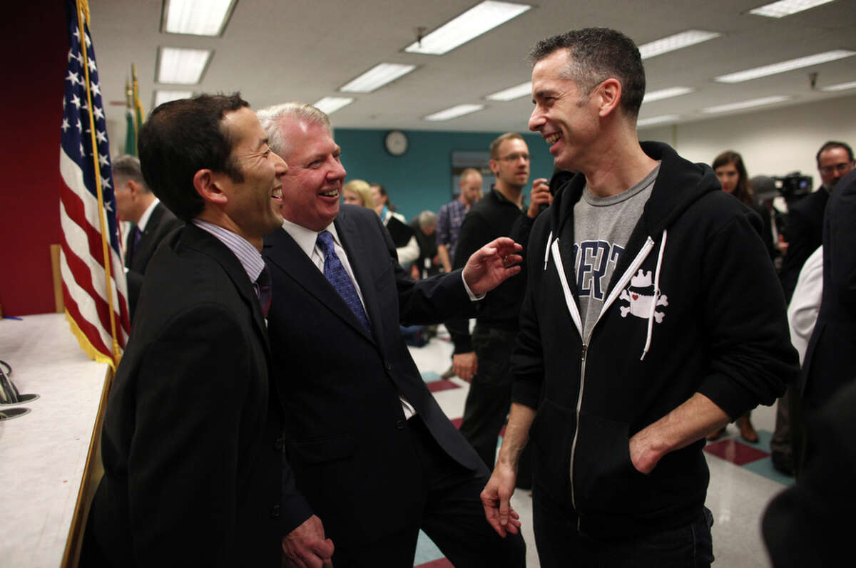 State Sen. Ed Murray, his now-husband Michael Shiosaki, and The Stranger's editorial director Dan Savage share a laugh after Savage was issued a mariage license.  The Stranger has now endorsed Mayor McGinn and is depicting Murray as an establishment dupe.
