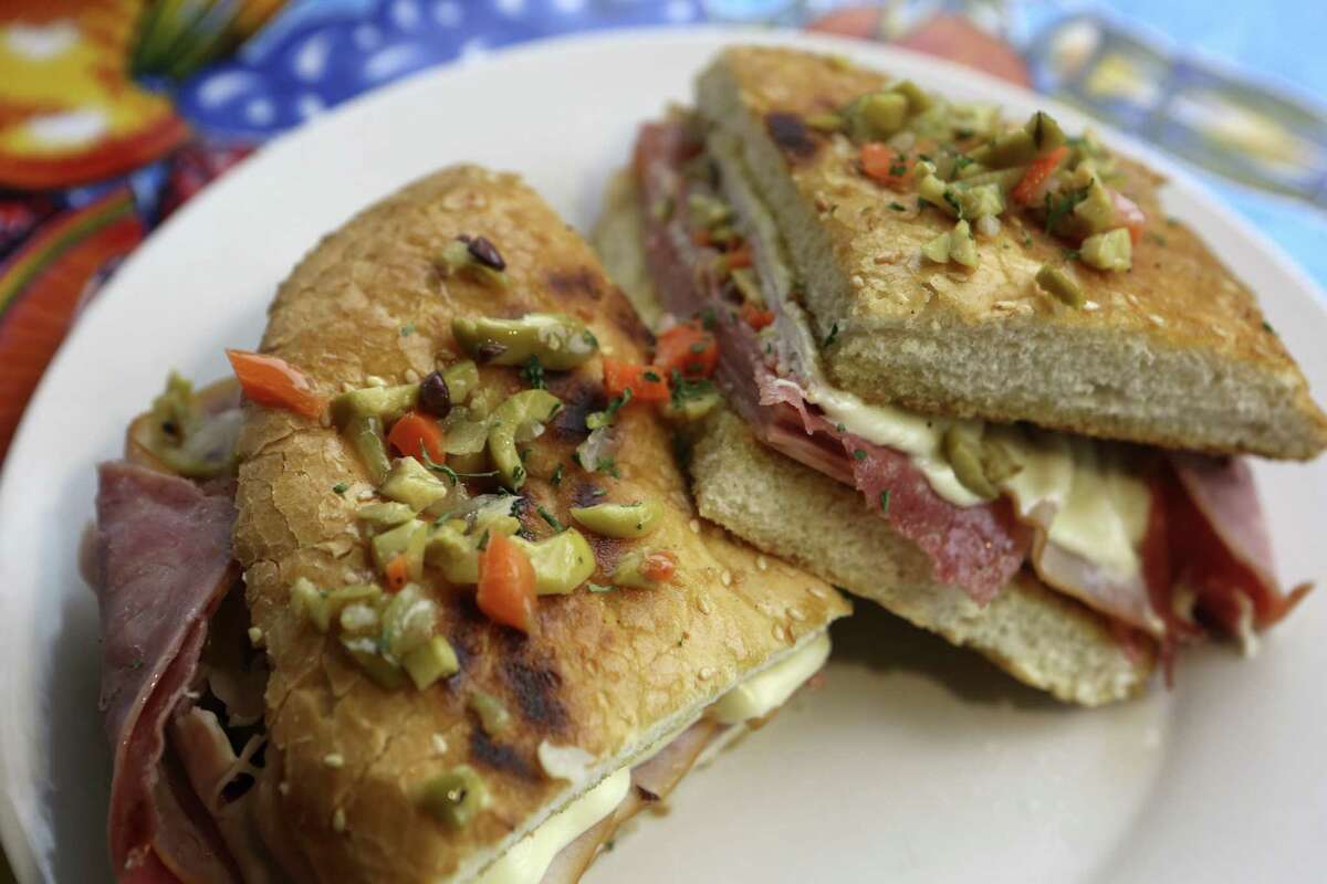 The muffaletta offers a stack of meats, provolone cheese and an oil-rich olive relish in a sturdy round bread.