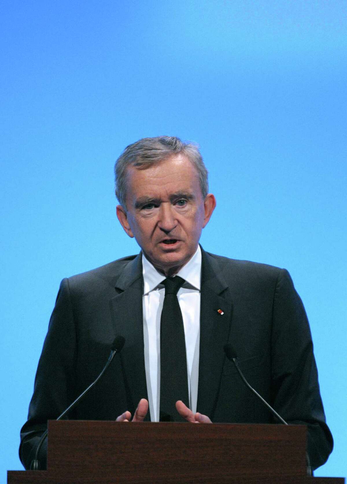 CORRECTION -- (FILES) This photo taken on January 31, 2013 shows Luxury group LVMH CEO Bernard Arnault presenting the group's 2012 annual results at company headquarters in Paris. Arnault has renounced his demand for Belgian citizenship, according to an interview in French daily newspaper Le Monde on April 10, 2013. AFP PHOTO / FRANCOIS GUILLOTERIC PIERMONT/AFP/Getty Images