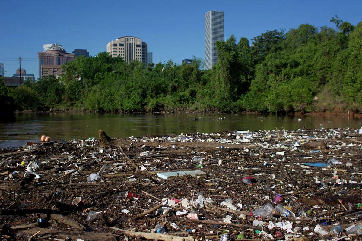 Plastic bottles, Styrofoam cups and other garbage create a debris field along the shoreline of Buffalo Bayou just northeast of downtown Houston.