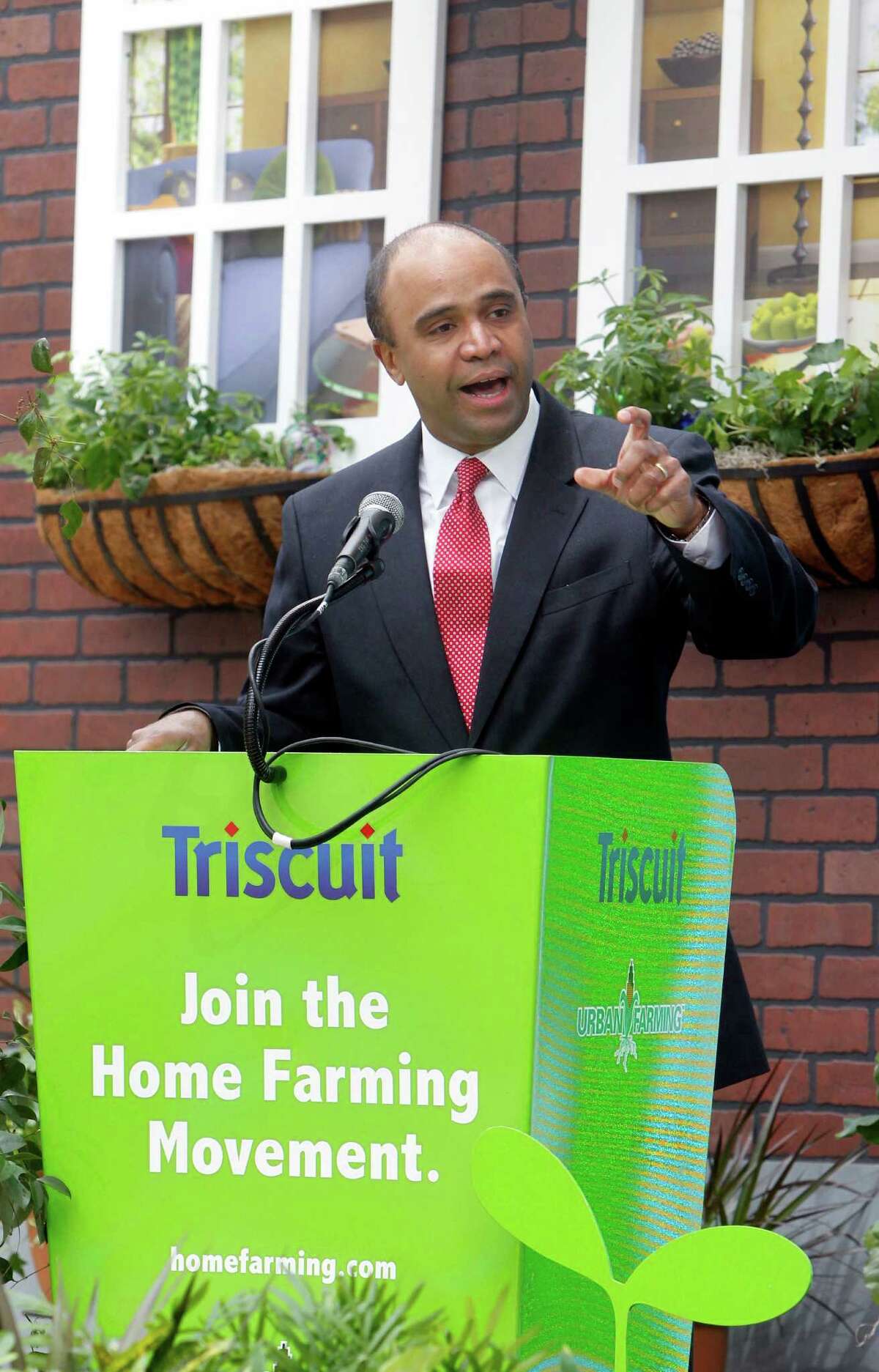 In this Tuesday, April 12, 2011 file photo Adolfo Carrion Jr., regional administrator of the U.S. Department of Housing and Urban Development, speaks at Triscuit Crackers 'Home Farming Day' celebration in New York's Madison Square Park. It sounds like a mismatch: a son of an illustrious Republican president supporting a Democrat-turned-independent, ex-Obama administration official in his quest to run for New York City mayor on the GOP line. But Michael Reagan is urging city Republican leaders to give Adolfo Carrion Jr. permission to run in the primary, saying it would strike a note of openness and diversity for a party that?’s grappling with how to attract Hispanic voters. (Jason DeCrow/AP Images for Kraft Foods)