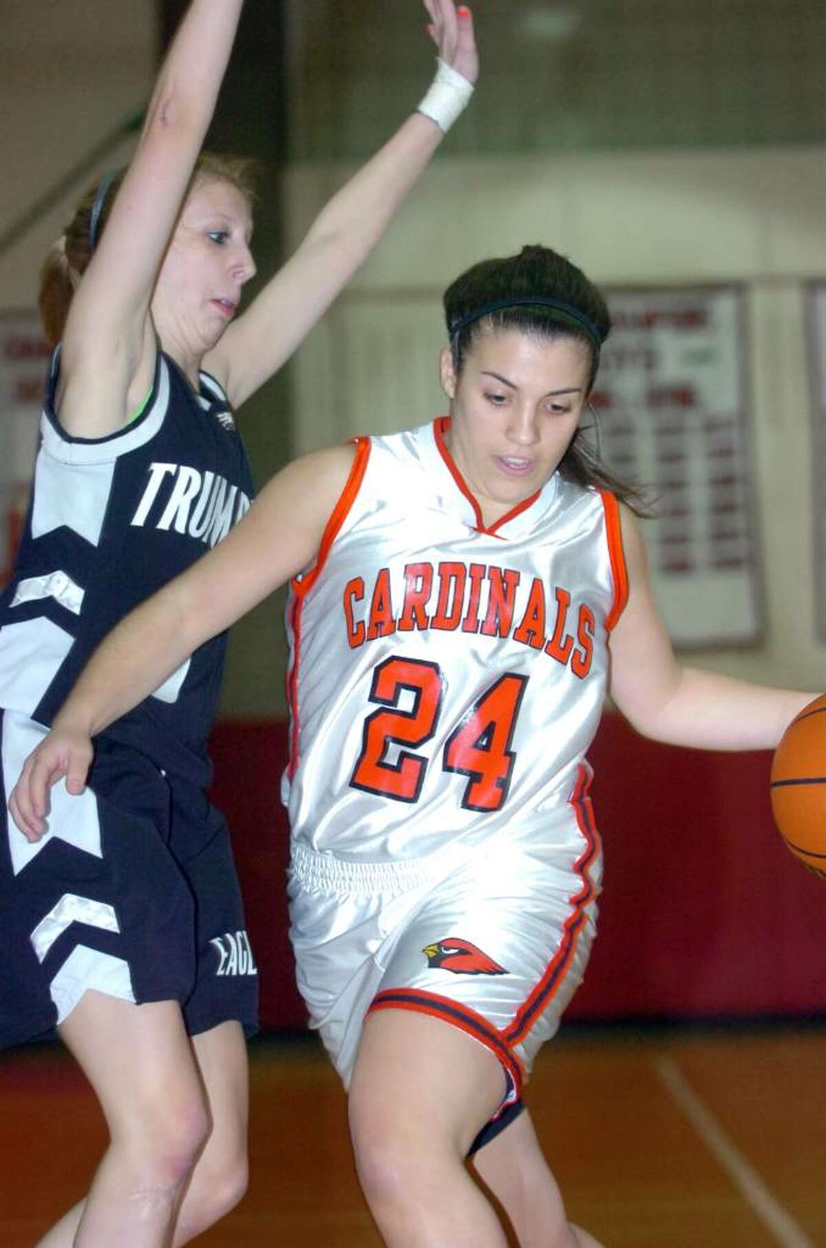 Greenwich basketball captain Jessica Fiscella pushes past Trumbull's Alli Kirby as Greenwich High School hosts Trumbull in a girls basketball game Tuesday evening, January 5, 2010. Trumbull won the game, 51-30.