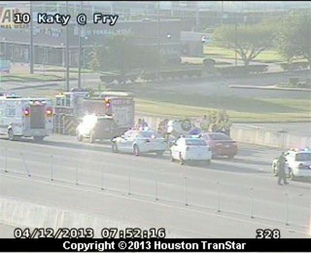 Overturned car snarls Katy Freeway near Fry Road